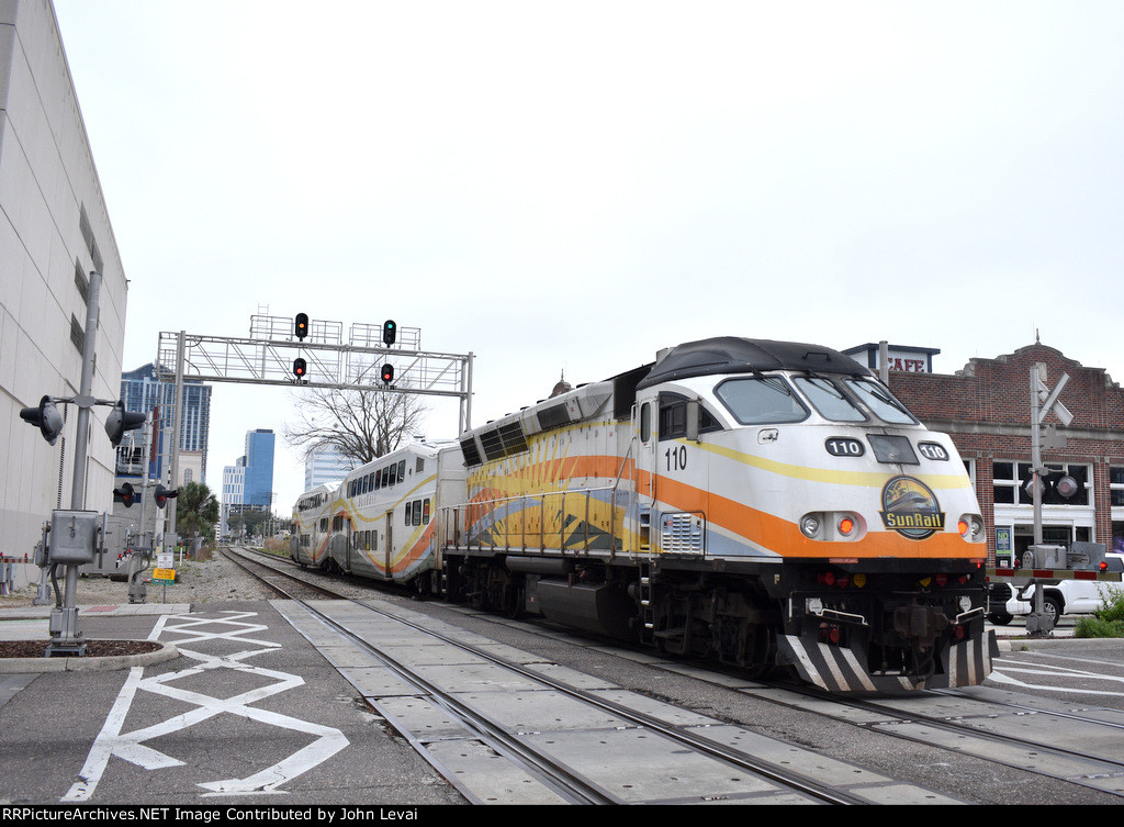 MP32PH-Q # 110 pushes the train toward the next stop of Church Street 